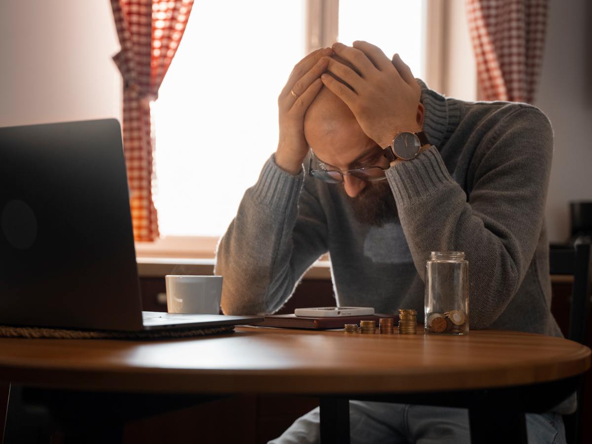 man saving money energy crisis