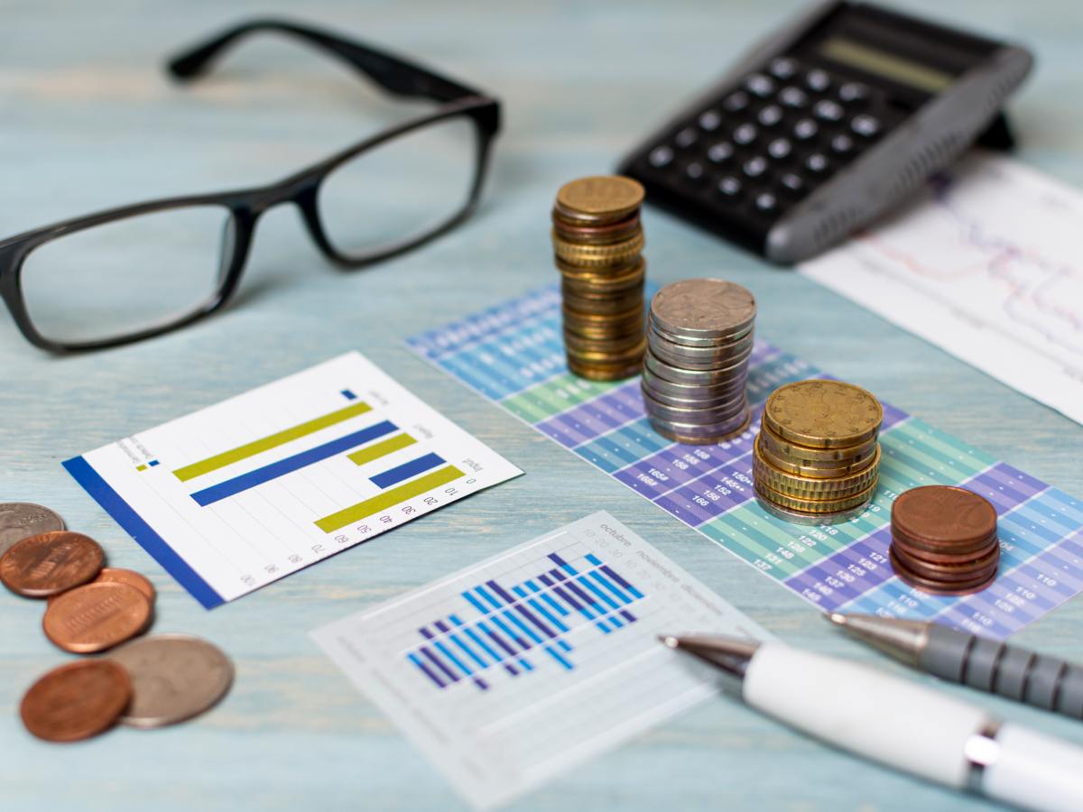 reading glasses piles coins high view